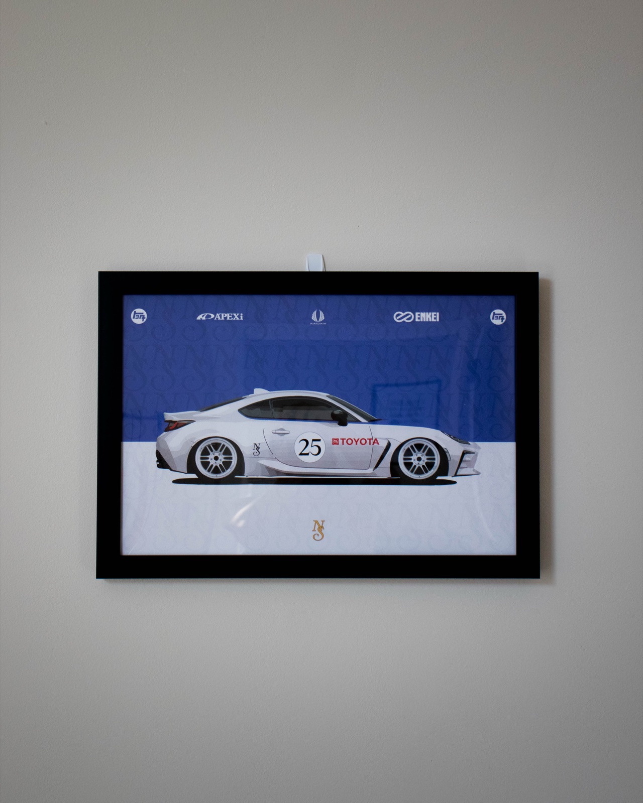 Framed New Stage livery poster on the wall